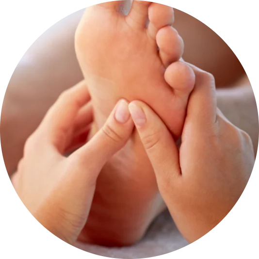 Feet being held during a reflexology treatment